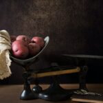 sweet potatoes on top of black metal beam balance